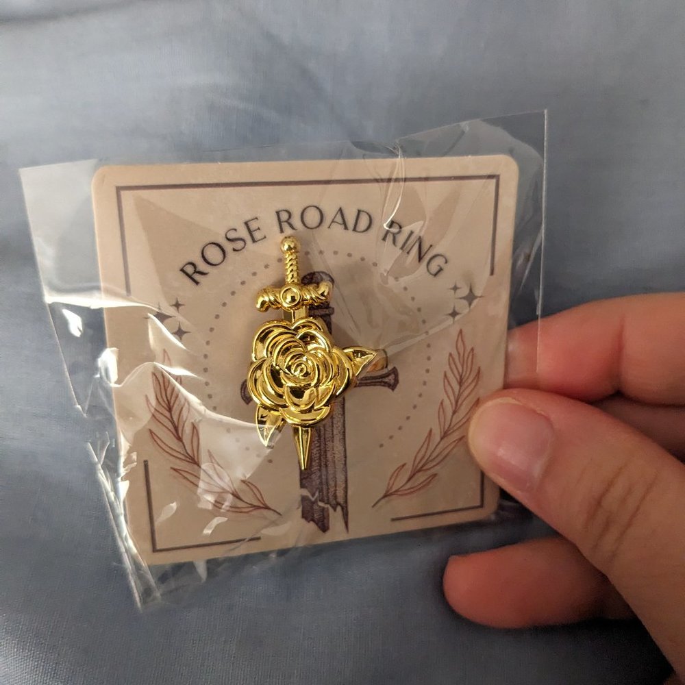 Broken blade rose ring